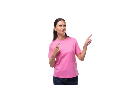 young stylish woman with straight black hair is wearing a pink t-shirt with mockup.