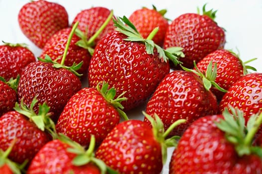 Strawberries. Healthy fresh summer fruit. Background with food. Yoghurt with fresh fruit.