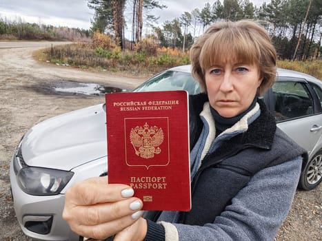 Driver girl with Russian passport and car. Russian cars banned for entering in Europe. Russian tourism closed during war of Russia and Uk. Confiscation of Russian car and sanctions against Russians