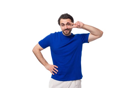 young european brunette man with beard dressed in blue t-shirt with identity print mockup.