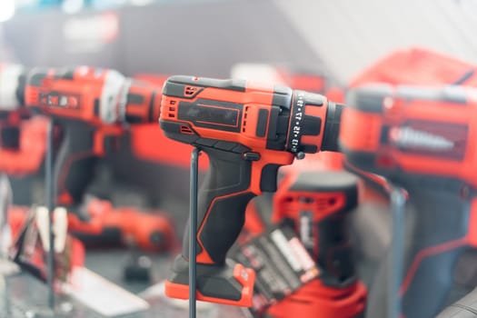 Power tools, drills and hammers of various manufacturers are sold in hardware store.