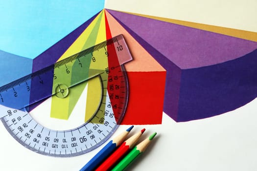 Business concept. Colored pencils and ruler on the background of the diagram