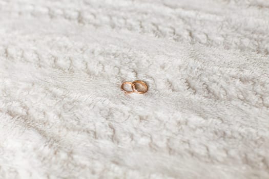 Close-up of wedding rings. Two gold wedding rings, jewelry for wedding
