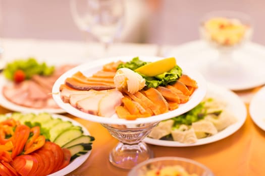 Assorted fish on a plate on festive table