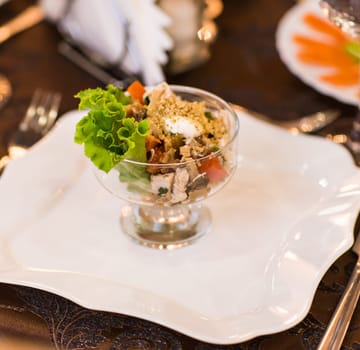 salad with cheese mushrooms and ham on festive table