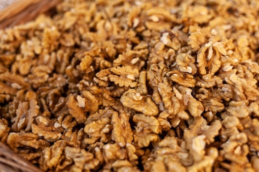 Closeup of Peeled Walnuts Pile. Many Different Textured Walnuts. Walnuts Background. Selling shelled nuts at the market