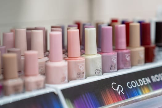 14.10.2023, Kemervo, Russia. Showcase with different nail polishes in a store window. Multi-colored nail polishes for buyer's choice. Beauty and nail care.