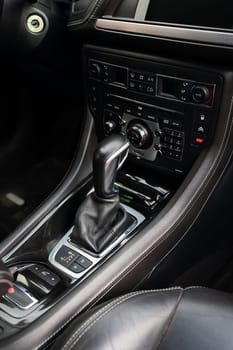 Close-up of an automatic transmission lever. Car interior, automatic transmission gear knob