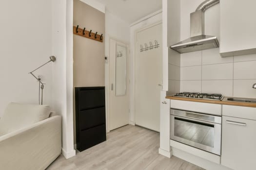 a kitchen area with an oven, sink and dishwasher on the floor in a room that has white walls