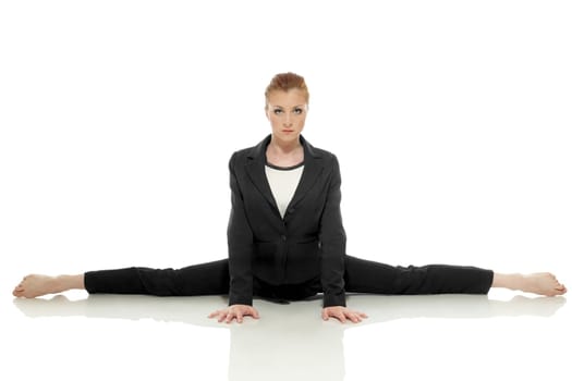 Strict businesswoman posing doing gymnastic split, isolated on white