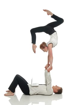 Acrobatic business people doing handstand in pair, isolated on white