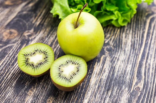 Green apple and kiwi and green salad. Diet concept.