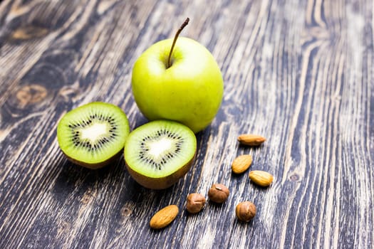 Green apple and kiwi and almond. Diet concept.