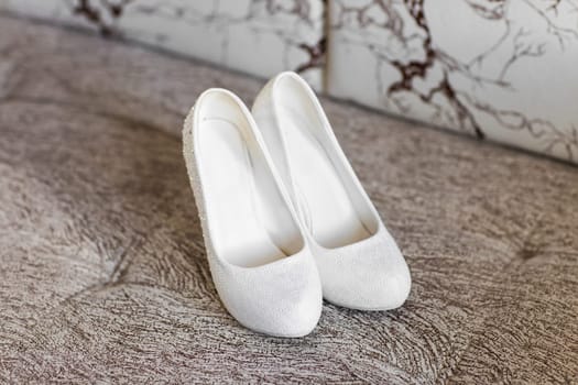 White high heel women shoes. White bride's shoes