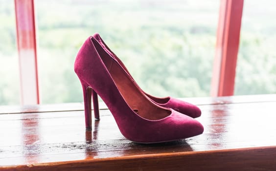 Close up of a pink high heels shoes.