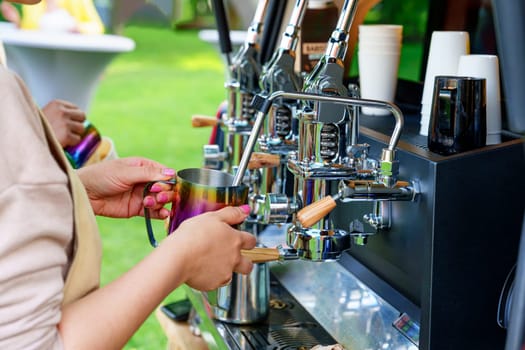 Barista Making Tasty Coffee on a Professional Machine Installed in the Backside of a Minivan: Food Service, Best Coffee, and Events Outdoors