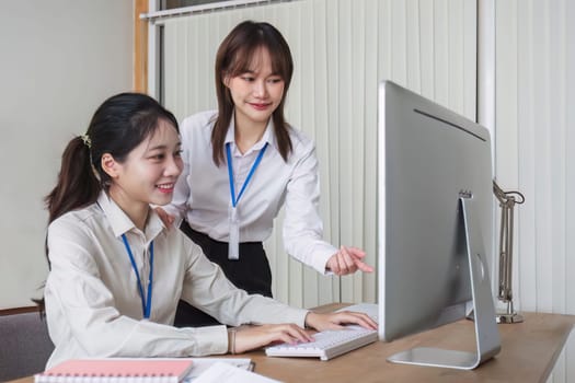 Two businessmen discussing project strategy in office conference room Businesswoman discusses project planning with colleagues at work and gives advice on financial report..