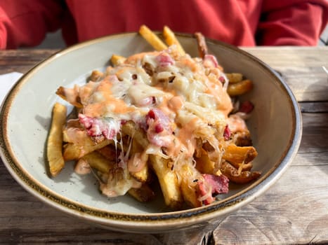 Glorified pub food at this brewery restaurant includes these reuben style french fries with corned beef, dressing, and cheese served hot.