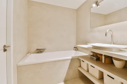 a bathroom with a tub, sink and bathtub in the corner next to it is a mirror on the wall