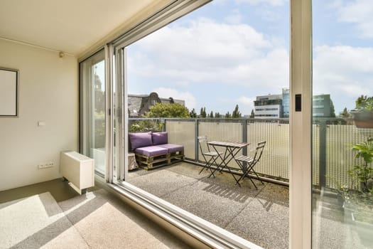 an outside area with chairs and tables on the balcony looking out onto the cityscapearrons com