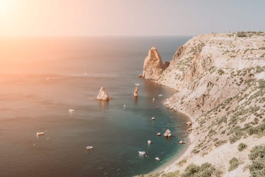 Aerial panoramic view of beautiful sunset above sea. Beautiful seascape. Sun glare, small waves on the water surface. Evening. Horizon. Nobody. No people. Copy space. Never-ending beauty of nature