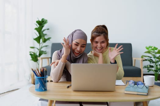 Muslim undergraduates and Asian women are studying online using computers