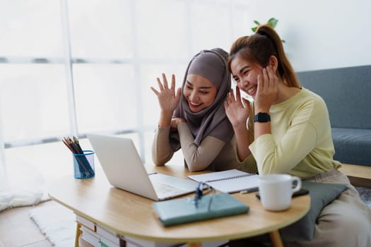 Muslim undergraduates and Asian women are studying online using computers