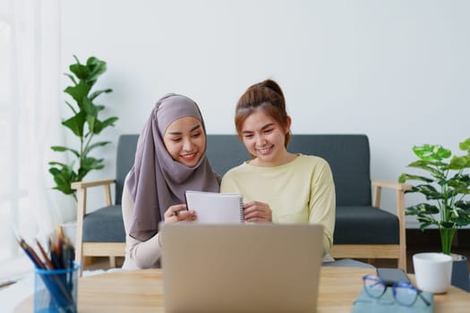 Muslim undergraduates and Asian women are studying online using computers