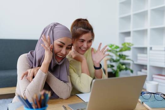 Muslim undergraduates and Asian women are studying online using computers