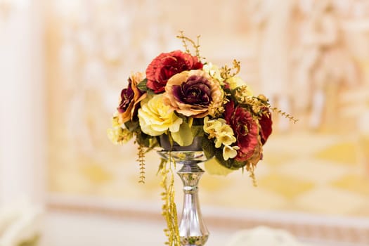 Artificial nice flowers bouquet in vase indoors