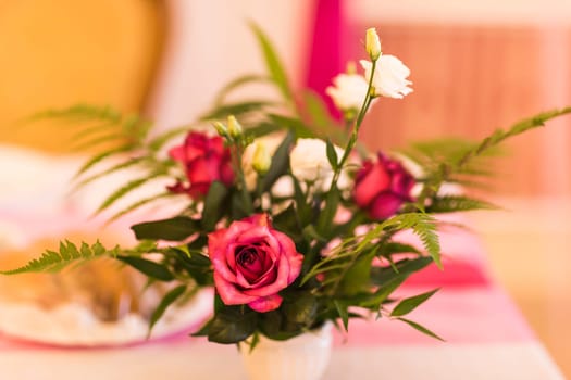 Floral decoration on festive table. floral arrangement in the design of a festive table