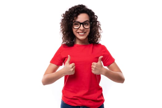 close-up of a caucasian young pretty curly brunette woman in a red t-shirt.