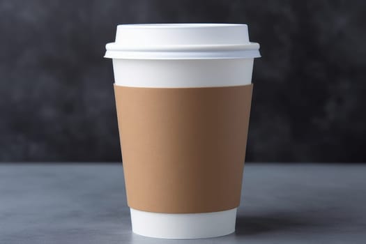Paper cup for coffee on a concrete surface on a blurred background.