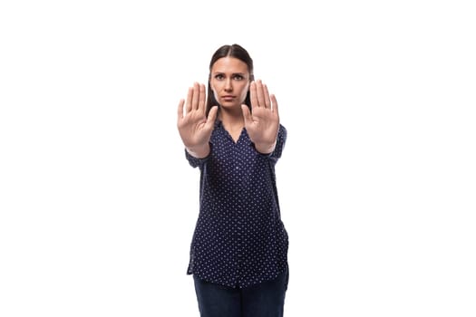 young caucasian fashionable brunette woman dressed in a dark blue blouse is feeling dissatisfied.