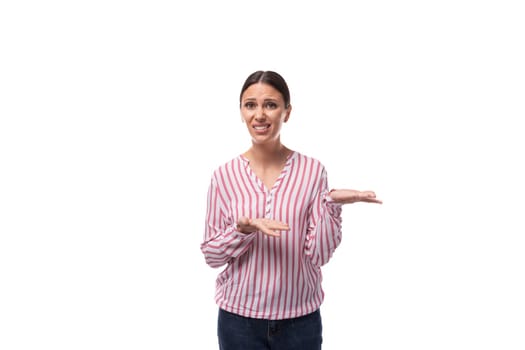 young successful smart brunette business woman dressed in a striped shirt on a white background with copy space.