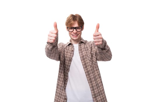 caucasian young man with red hair in shirt shows like.