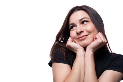 Young pretty european woman dressed in a black t-shirt smiling.