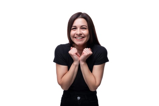 Portrait of young joyful cheerful brunette woman on studio white background.