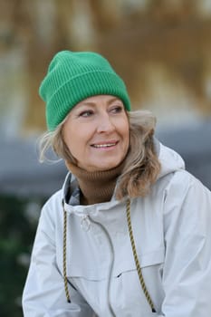 Portrait of a fifty-year-old woman with a white smile