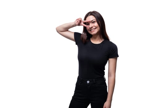 Caucasian young brunette woman with black hair greeting on white background.