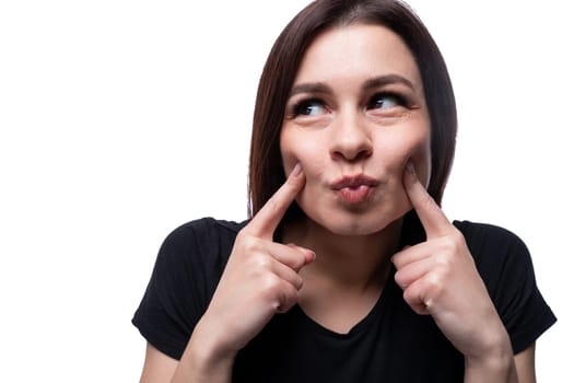 Young happy lady with brown eyes on a background with copy space.