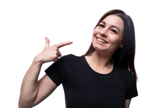 Young happy lady with brown eyes on a background with copy space.
