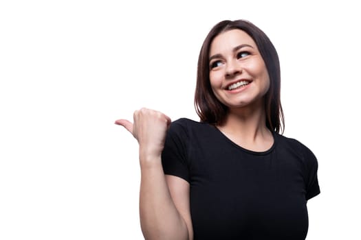 Young surprised woman looking to the side against a background with copy space.