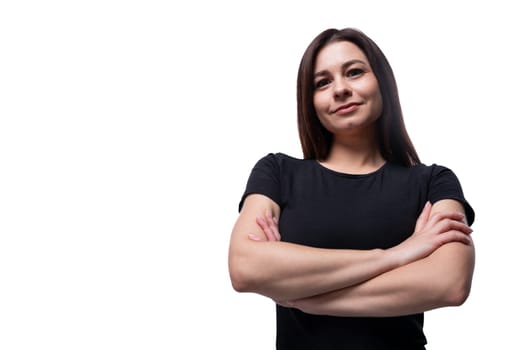 Caucasian young strong brunette woman with black hair on a background with copy space.
