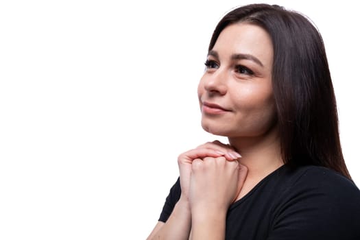 Young dreamy european woman dressed in basic t-shirt closeup.