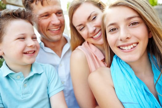 Portrait of a happy family. Happy family smiling while outdoors