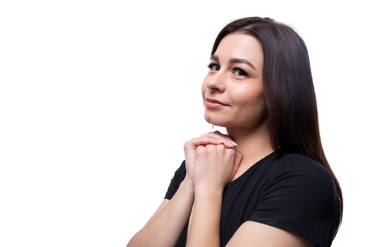 Young charming lady with brown eyes on a background with copy space.