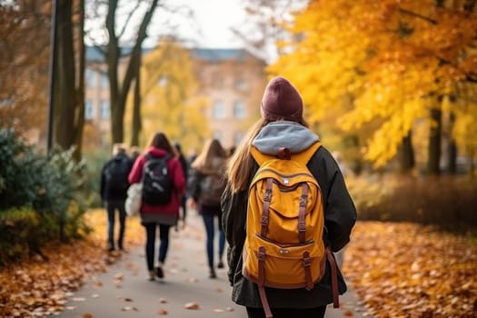 Rear view of two happy cute children, age 15, walking side by side on the street in the school area.by Generative AI.