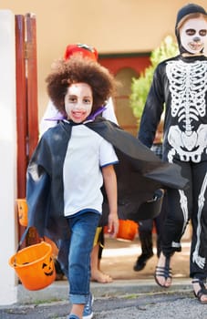 What a great costume. happy little children trick-or-treating on halloween