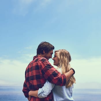 Theres no place Id rather be. an affectionate young couple enjoying a hike in the mountains